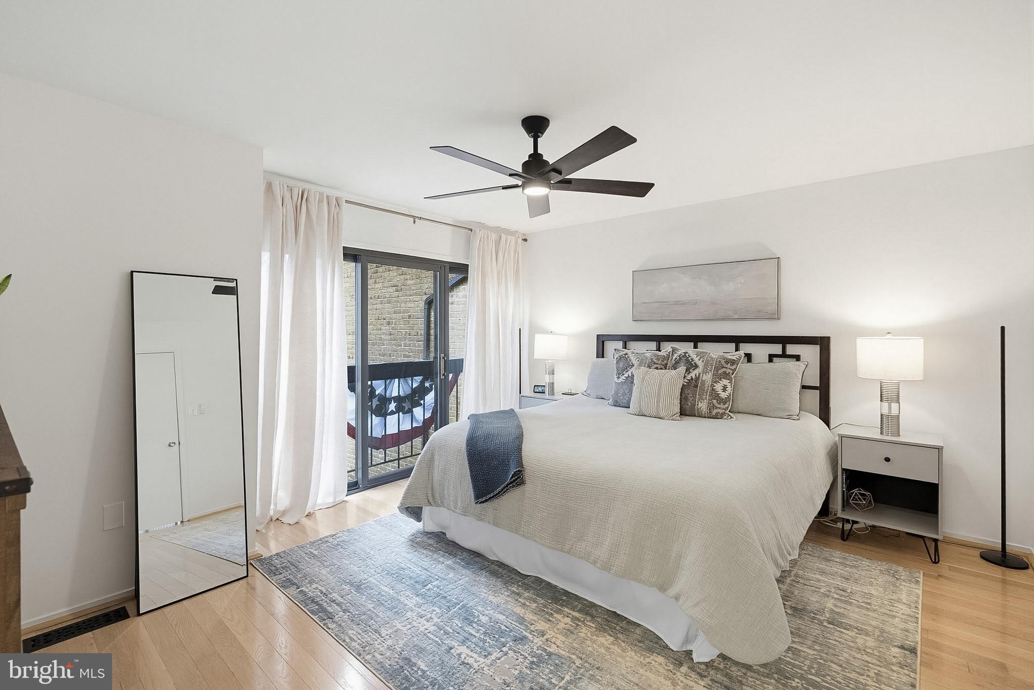 9060 Blarney Stone Drive Springfield, VA 22152 - Photo 20 of 47 a bedroom with a large bed and a chandelier