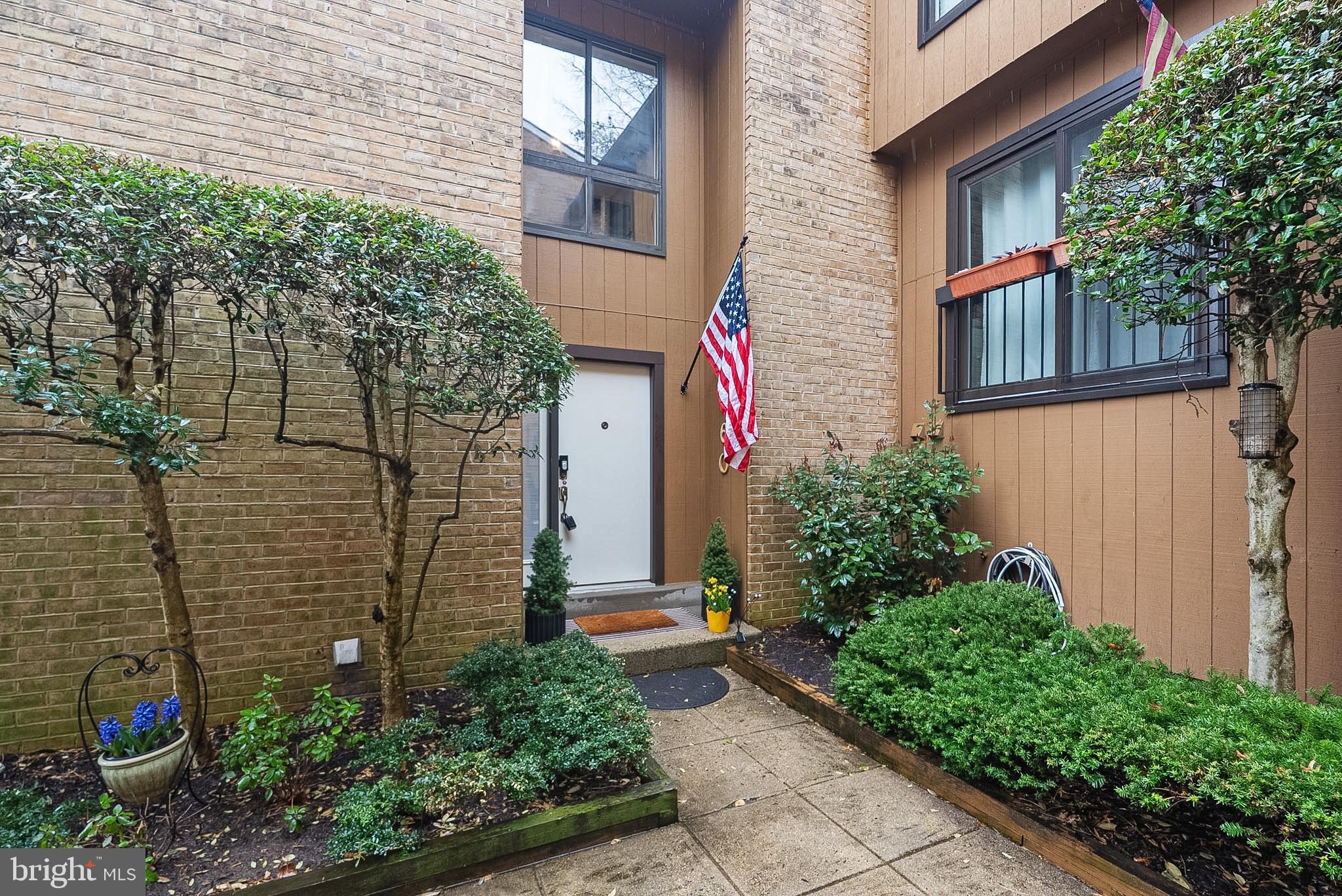 9060 Blarney Stone Drive Springfield, VA 22152 - Photo 2 of 47 a front view of a house with a yard and trees