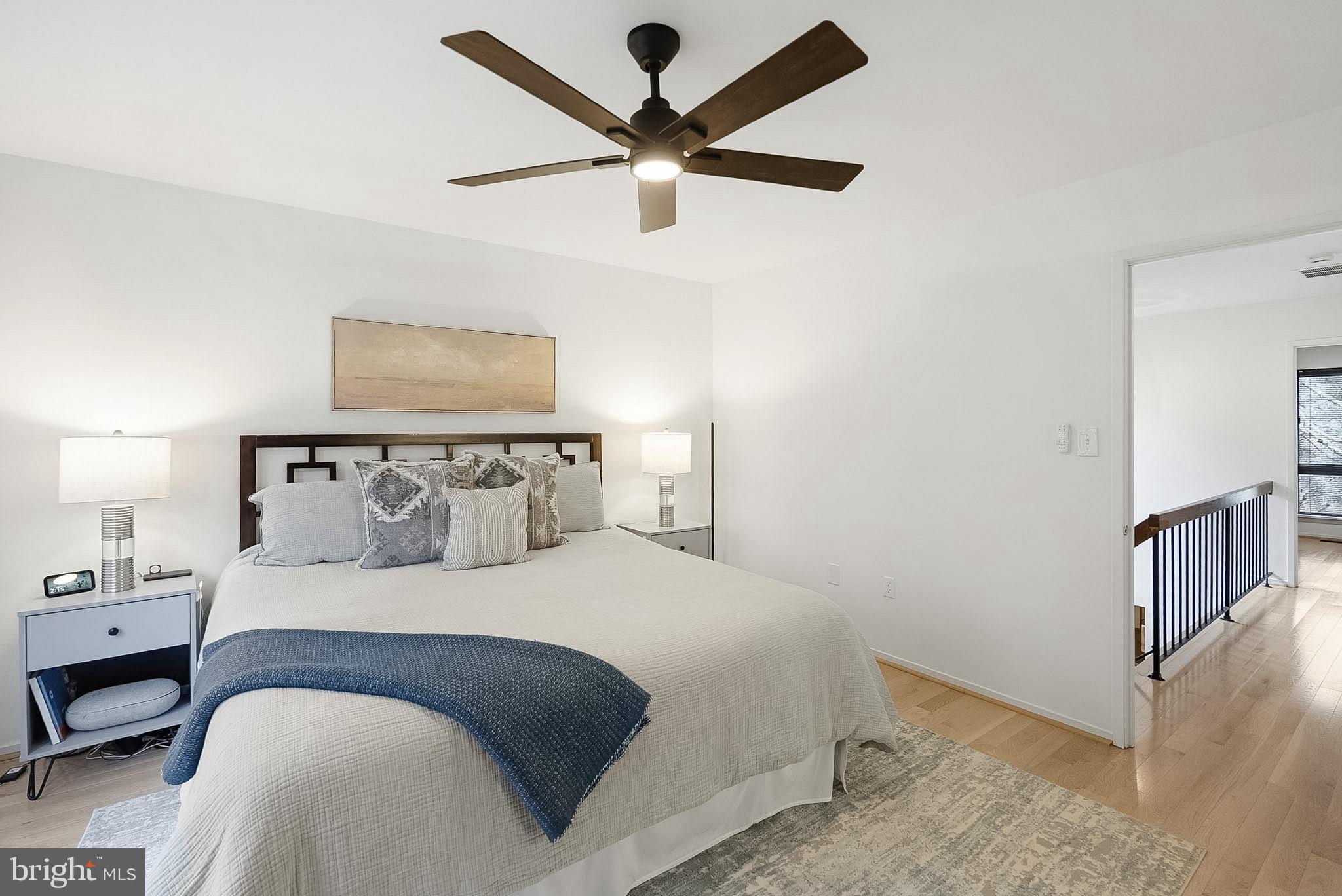 9060 Blarney Stone Drive Springfield, VA 22152 - Photo 21 of 47 a bedroom with a large bed and a chandelier
