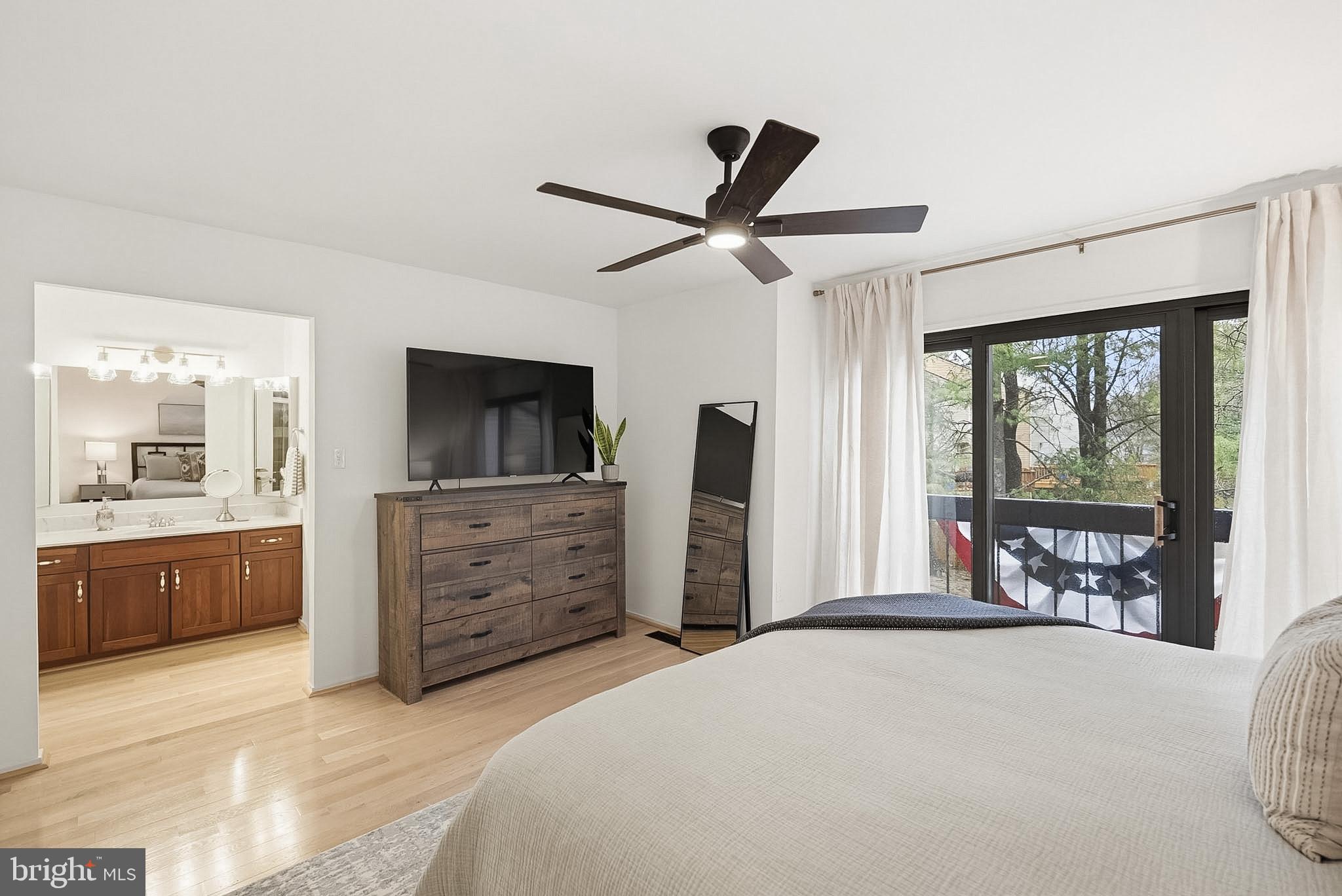 9060 Blarney Stone Drive Springfield, VA 22152 - Photo 22 of 47 a bedroom with furniture and a large window