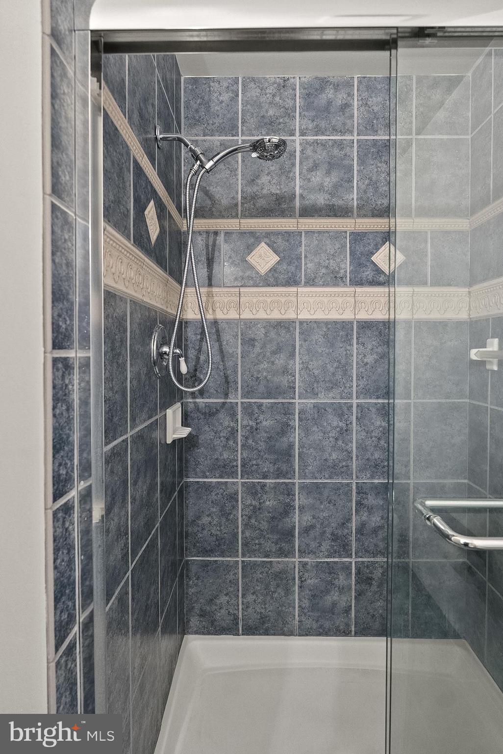 9060 Blarney Stone Drive Springfield, VA 22152 - Photo 25 of 47 a bathroom with a shower and a shower