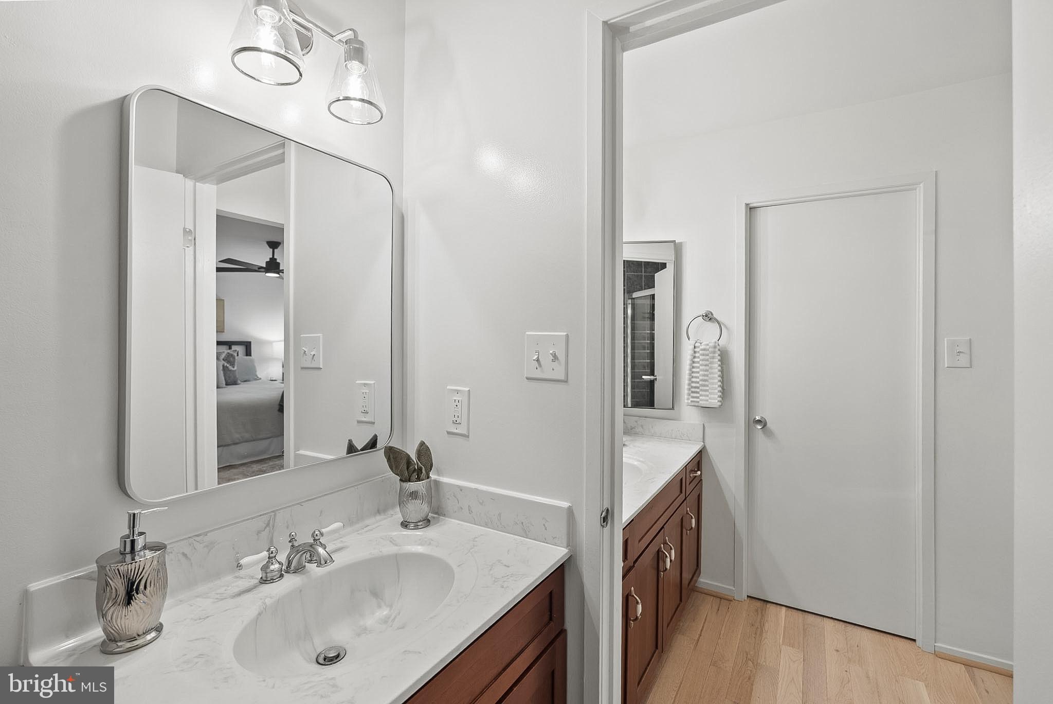 9060 Blarney Stone Drive Springfield, VA 22152 - Photo 26 of 47 a en suite bathroom with a double vanity sink a and mirror
