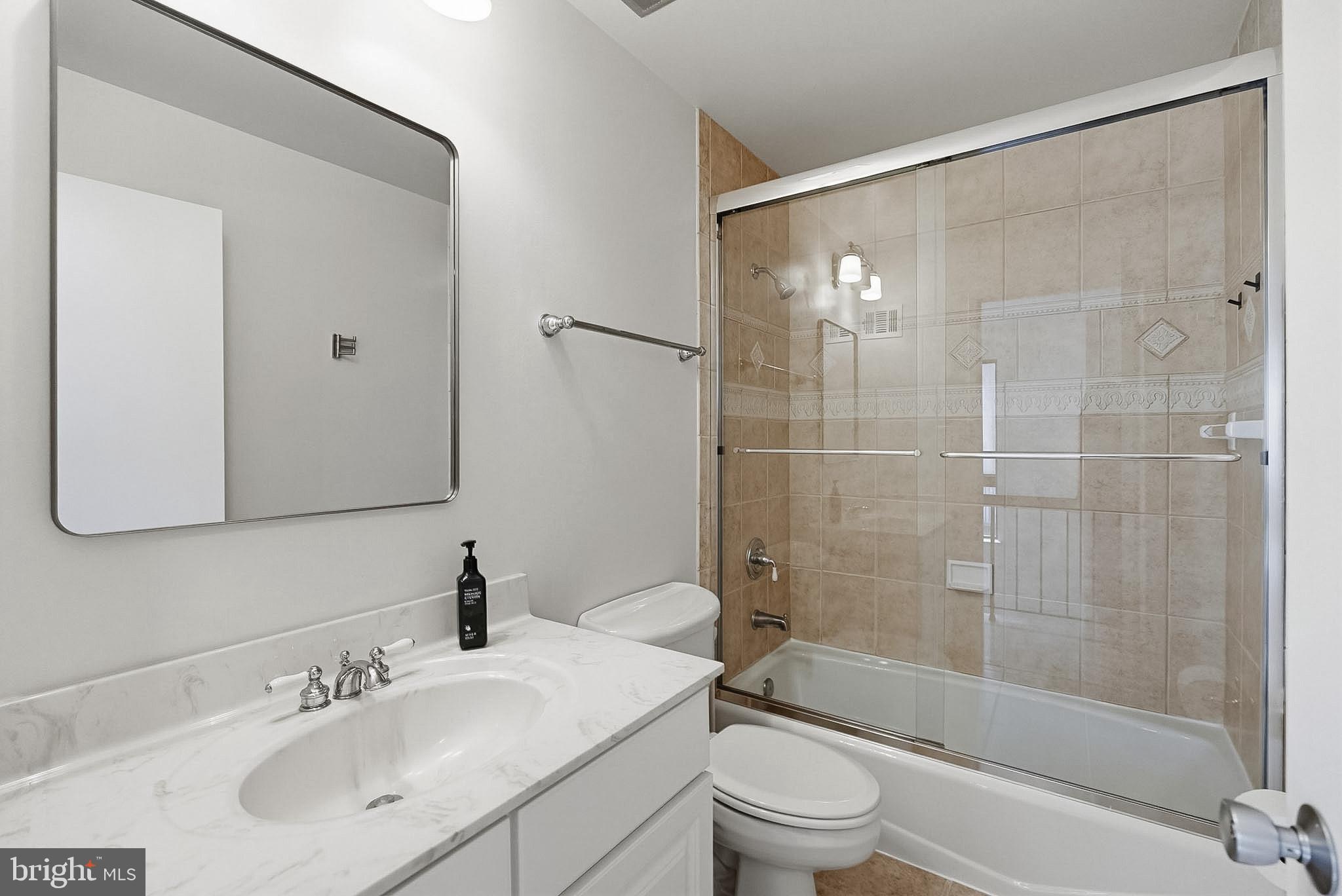9060 Blarney Stone Drive Springfield, VA 22152 - Photo 29 of 47 a bathroom with a bathtub shower sink vanity and toilet