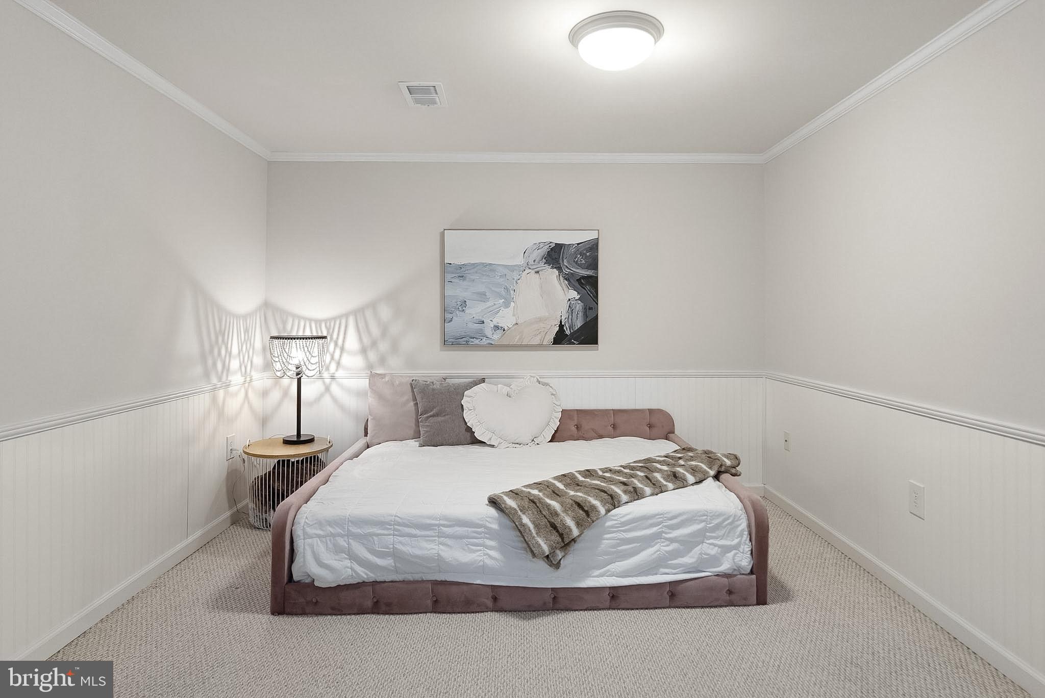 9060 Blarney Stone Drive Springfield, VA 22152 - Photo 40 of 47 a bedroom with a bed and a lamp