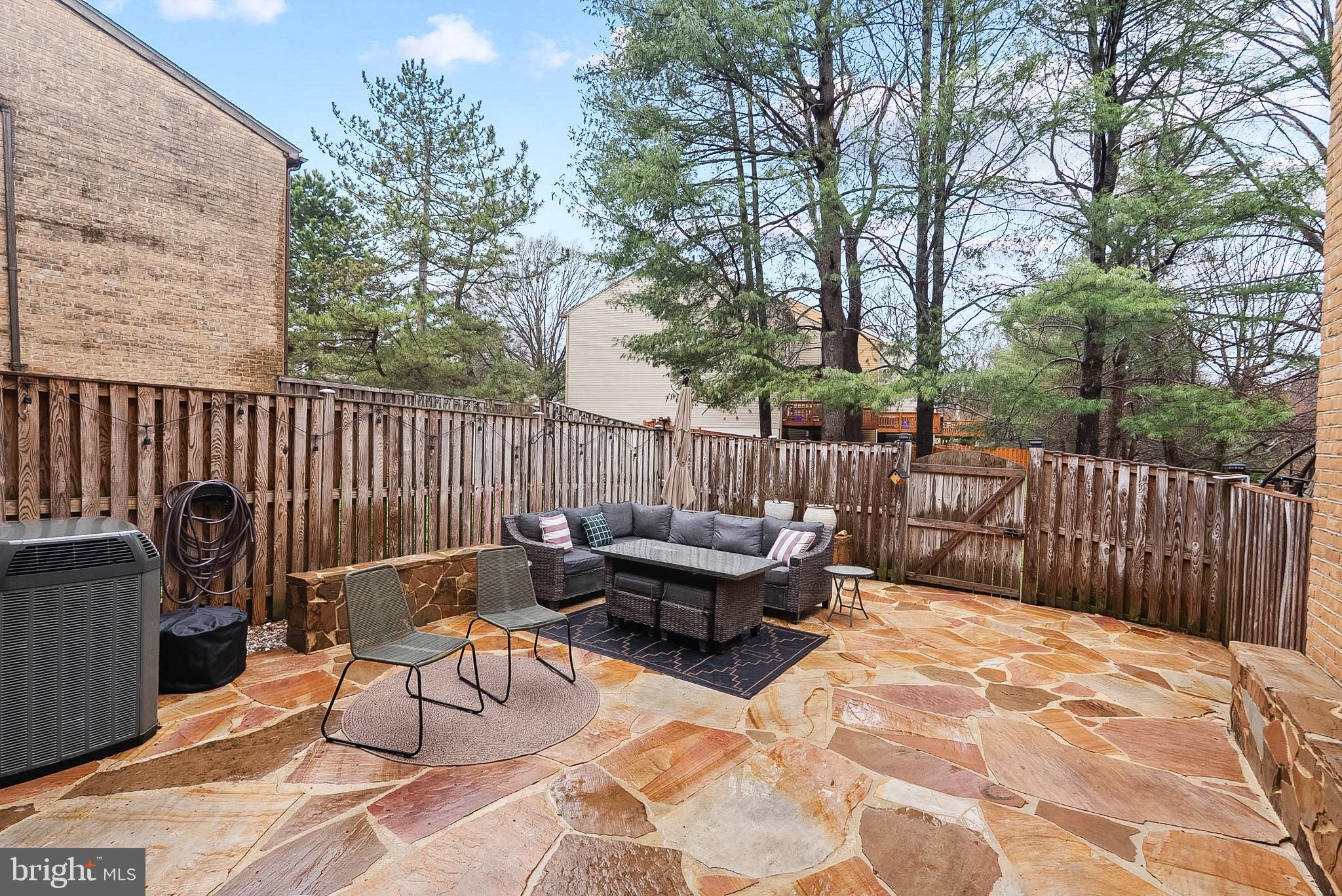 9060 Blarney Stone Drive Springfield, VA 22152 - Photo 45 of 47 a backyard of a house with table and chairs