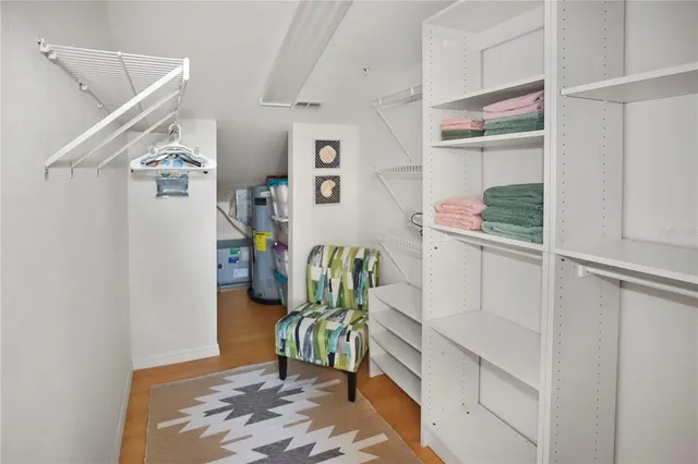 a spacious bedroom with two beds and a large window