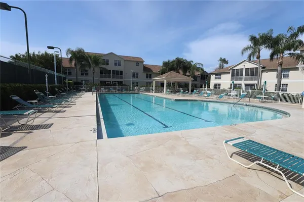 a view of a workspace with furniture and a bookshelf