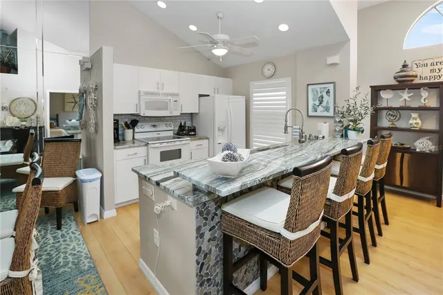 a living room with lots of furniture and a rug