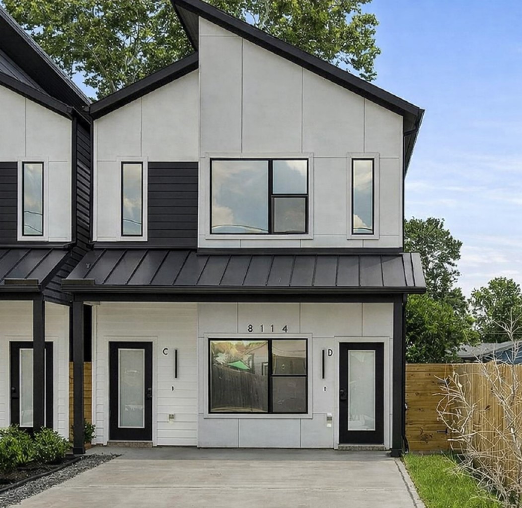 a front view of a house with lake