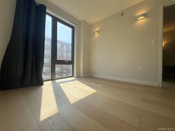 a view of an empty room and window