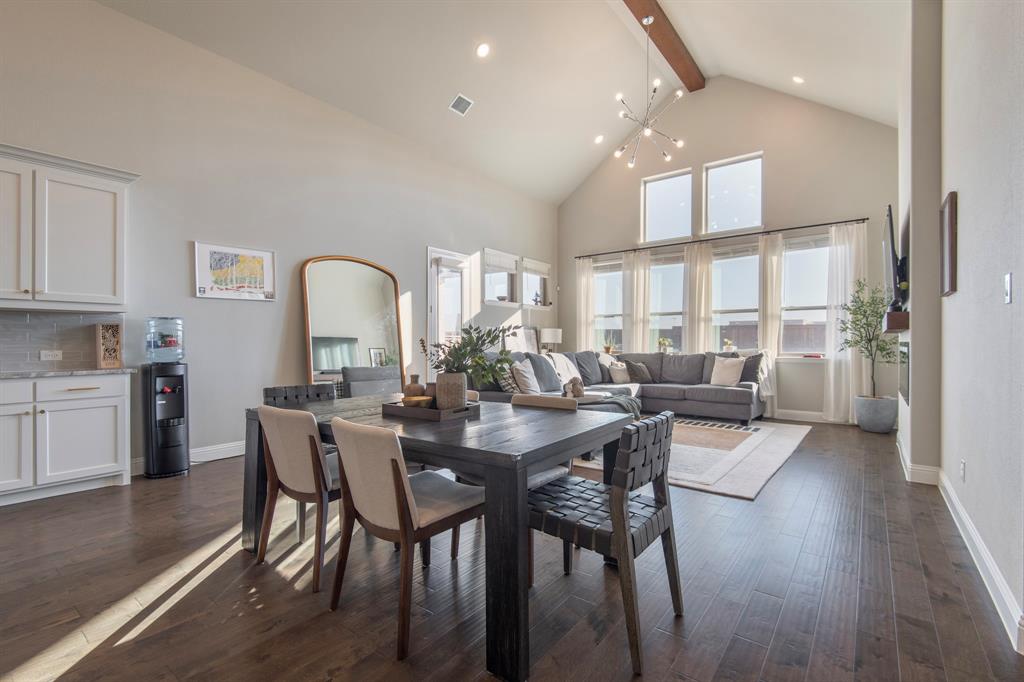 16650 Nightshade Road Frisco, TX 75033 - Photo 15 of 40 a view of a dining room with furniture and wooden floor