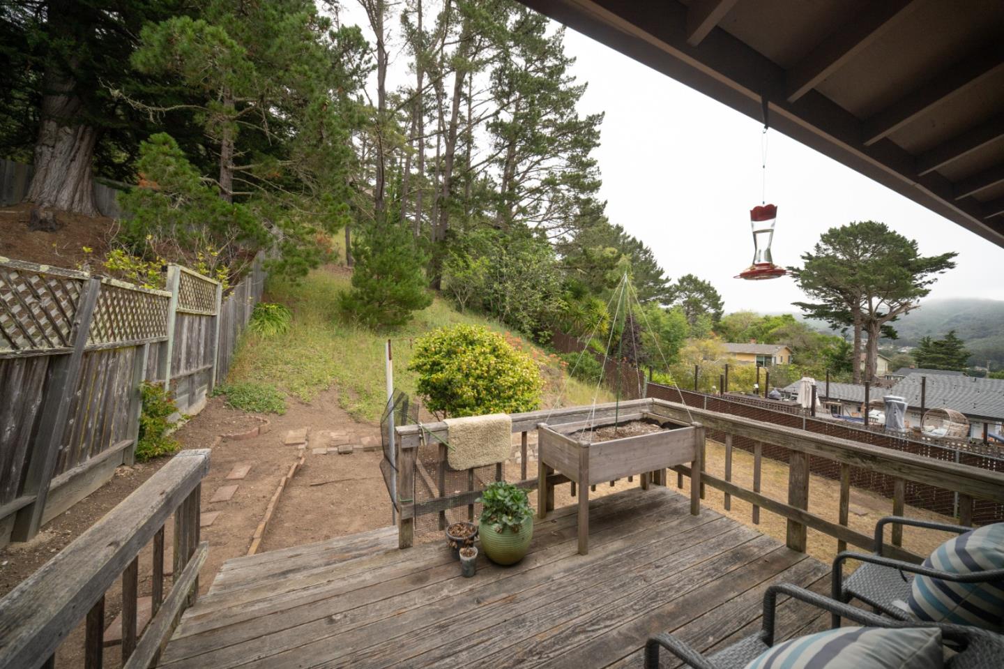 1287 Lerida Way Pacifica, CA 94044 - Photo 44 of 52 a view of deck with table and chairs and wooden floor