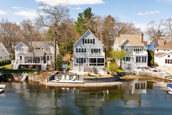 a house with river in front of it