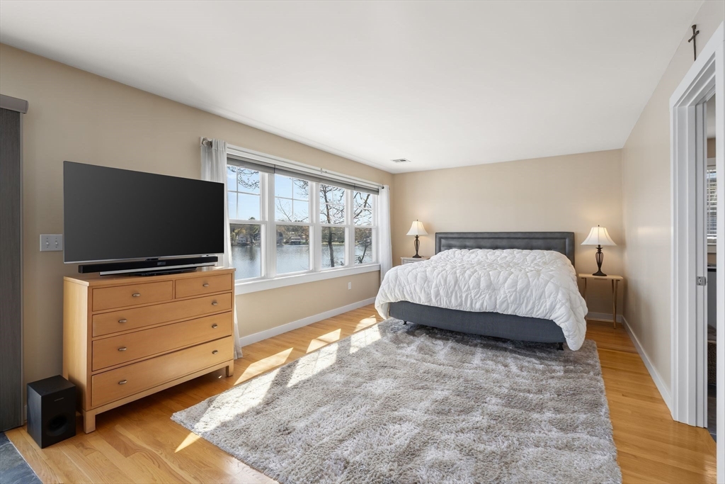 22 Pattison Road Webster, MA 01570 - Photo 16 of 42 a bedroom with a bed and flat screen tv