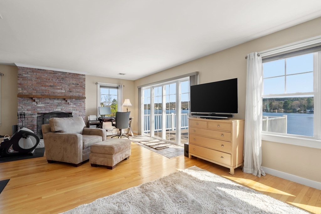 22 Pattison Road Webster, MA 01570 - Photo 19 of 42 a living room with furniture and a flat screen tv