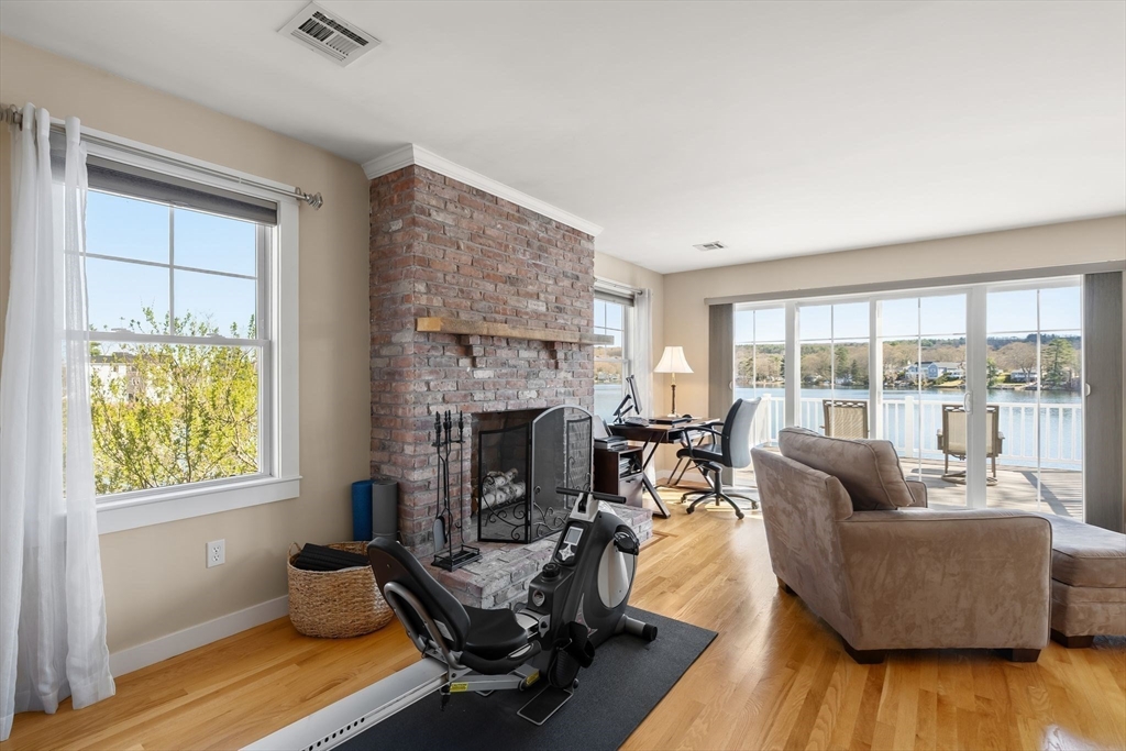 22 Pattison Road Webster, MA 01570 - Photo 20 of 42 a living room with furniture and a fireplace