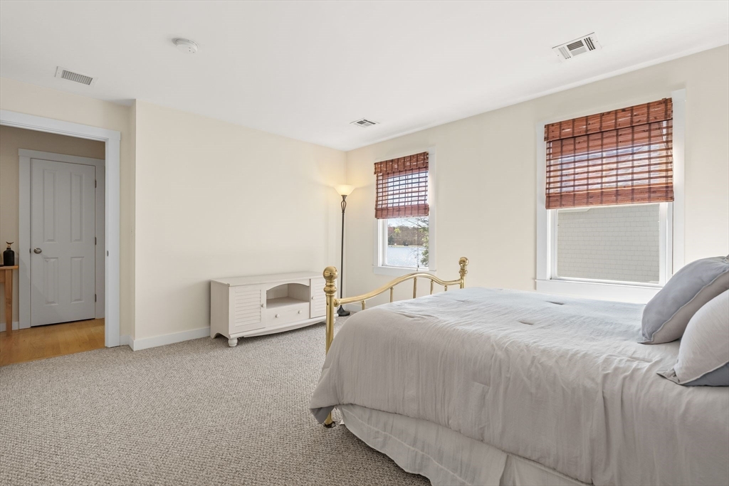 22 Pattison Road Webster, MA 01570 - Photo 22 of 42 a bedroom with a bed and a couch