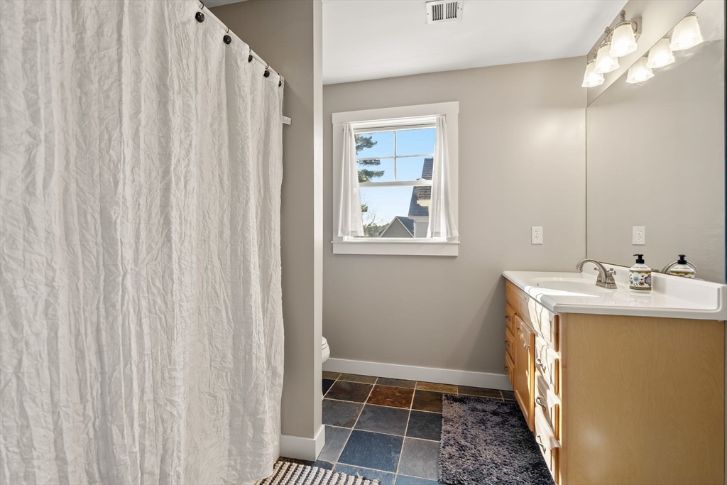 22 Pattison Road Webster, MA 01570 - Photo 24 of 42 a bathroom with a sink a mirror and a shower