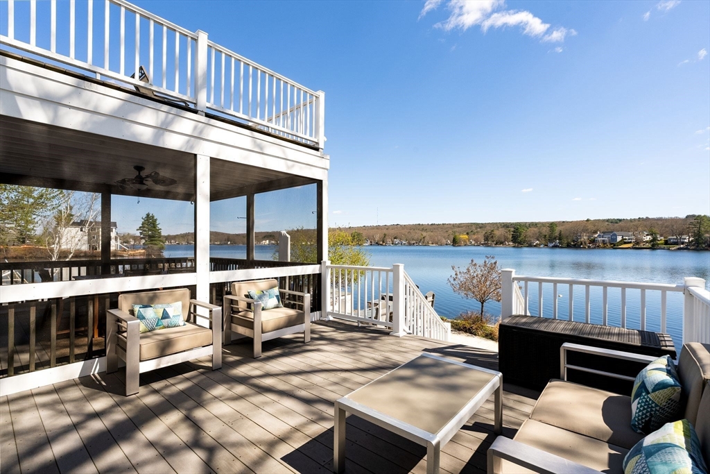 22 Pattison Road Webster, MA 01570 - Photo 32 of 42 a view of a balcony with wooden floor and outdoor seating