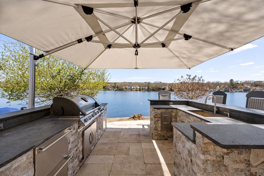 22 Pattison Road Webster, MA 01570 - Photo 34 of 42 a view of a terrace with furniture and umbrella