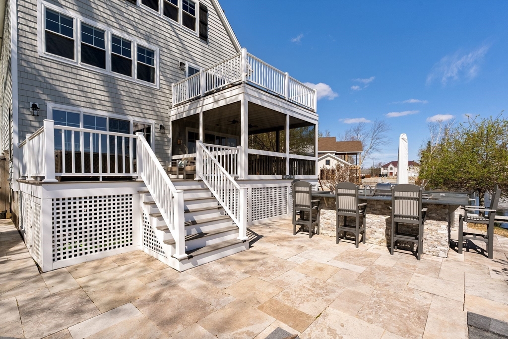 22 Pattison Road Webster, MA 01570 - Photo 38 of 42 a view of a patio with a chairs and table in the house