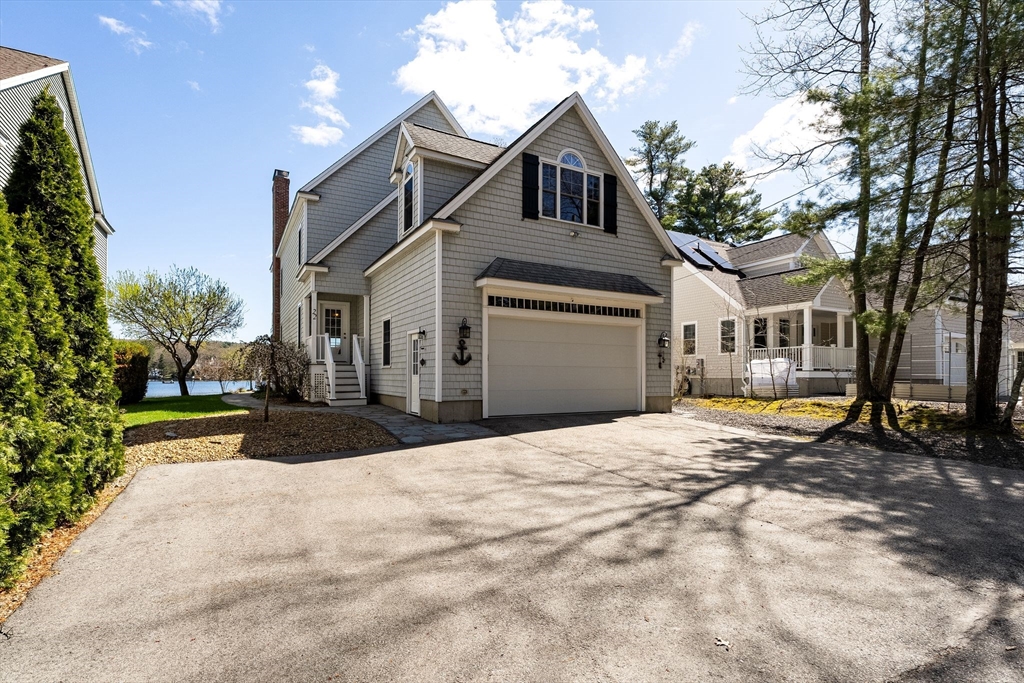 22 Pattison Road Webster, MA 01570 - Photo 40 of 42 a front view of a house with a yard and garage