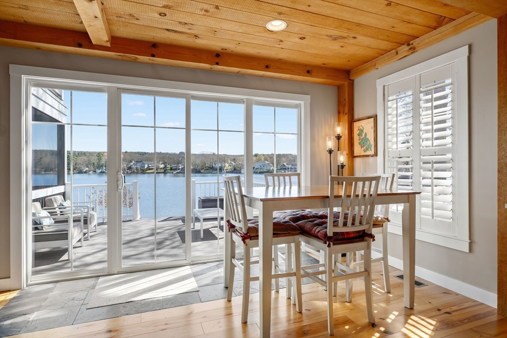 22 Pattison Road Webster, MA 01570 - Photo 4 of 42 a dining room with furniture and floor to ceiling windows