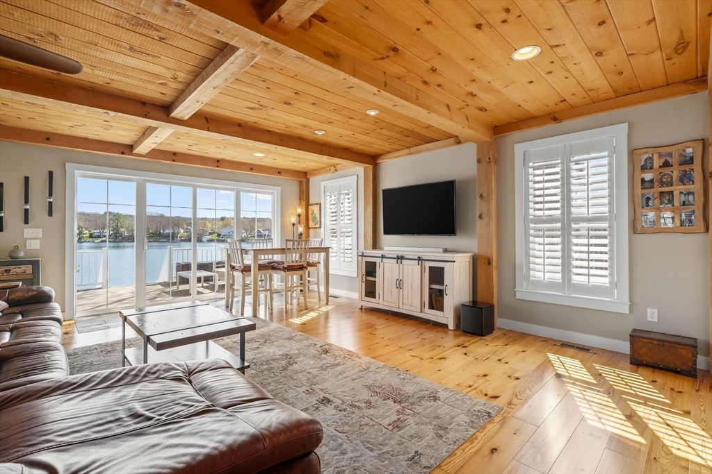 22 Pattison Road Webster, MA 01570 - Photo 5 of 42 a living room with furniture and a flat screen tv