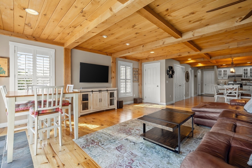 22 Pattison Road Webster, MA 01570 - Photo 9 of 42 a living room with furniture and a flat screen tv