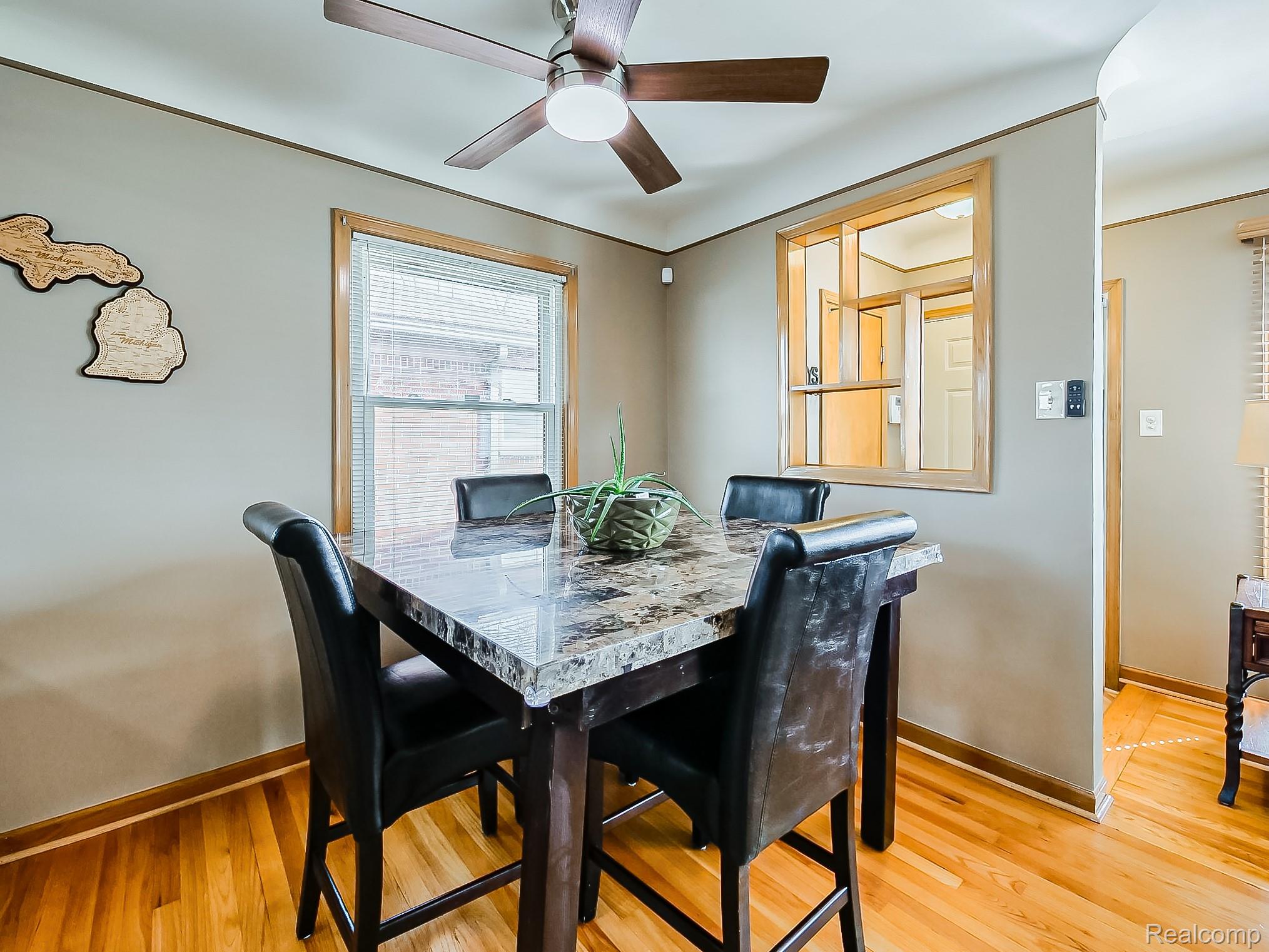 8634 Allen Road Allen Park, MI 48101 - Photo 9 of 38 Dining room featuring a ceiling fan and light wood-style floors