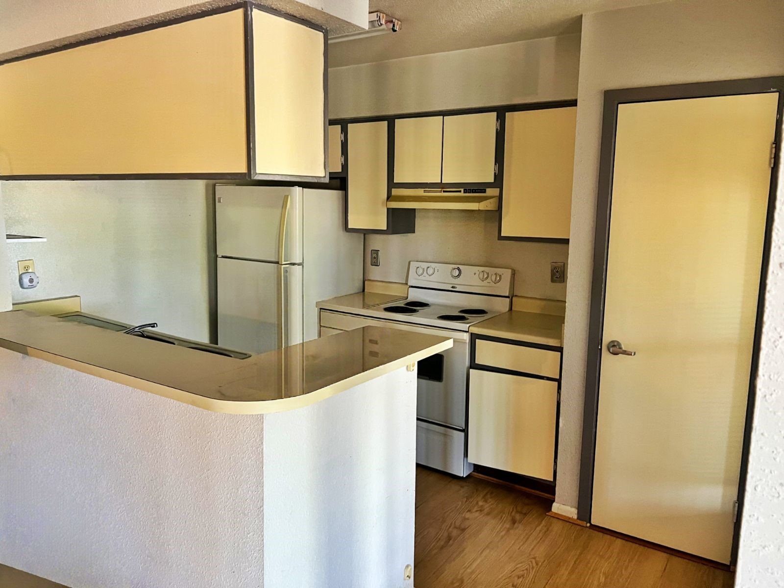 9000 Bissonnet Street, Unit 406 Houston, TX 77074 - Photo 7 of 8 a kitchen with stainless steel appliances a refrigerator sink and cabinets