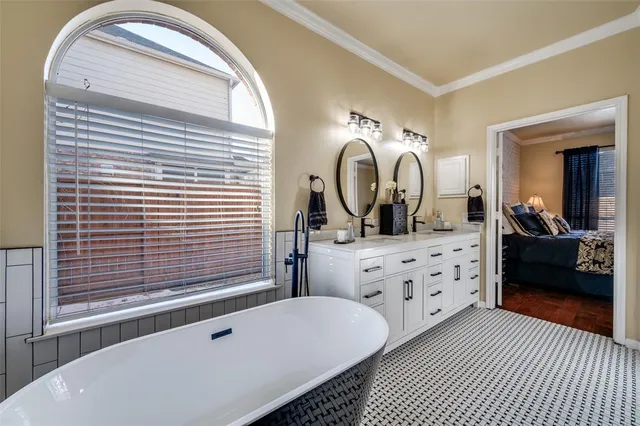 a bedroom with a bed a mirror and walk in closet