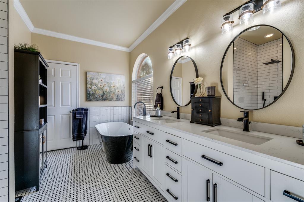 5904 Berkshire Road McKinney, TX 75072 - Photo 9 of 26 a bathroom with a double vanity sink double and a mirror