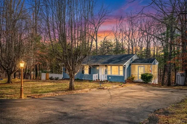 a house with trees in front of it