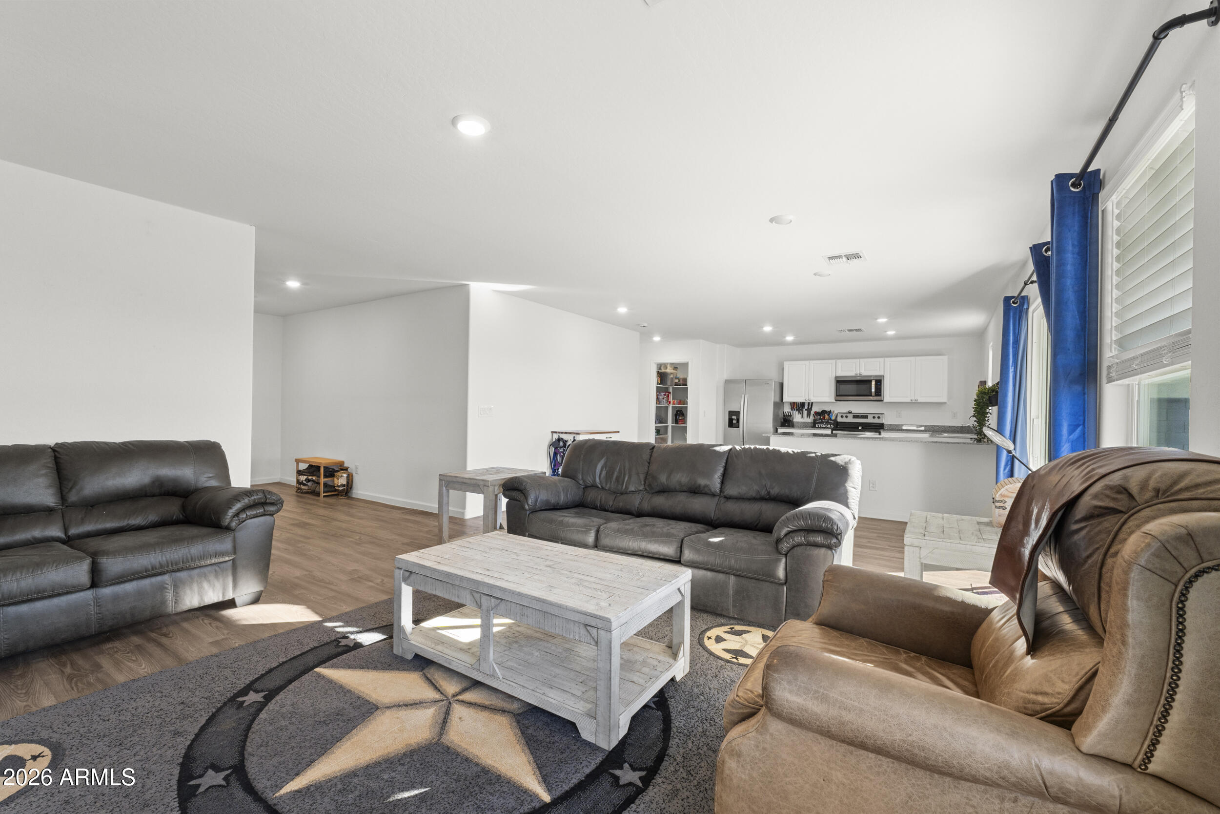 83 South Naples Lane Casa Grande, AZ 85122 - Photo 15 of 26 a living room with furniture and a view of kitchen