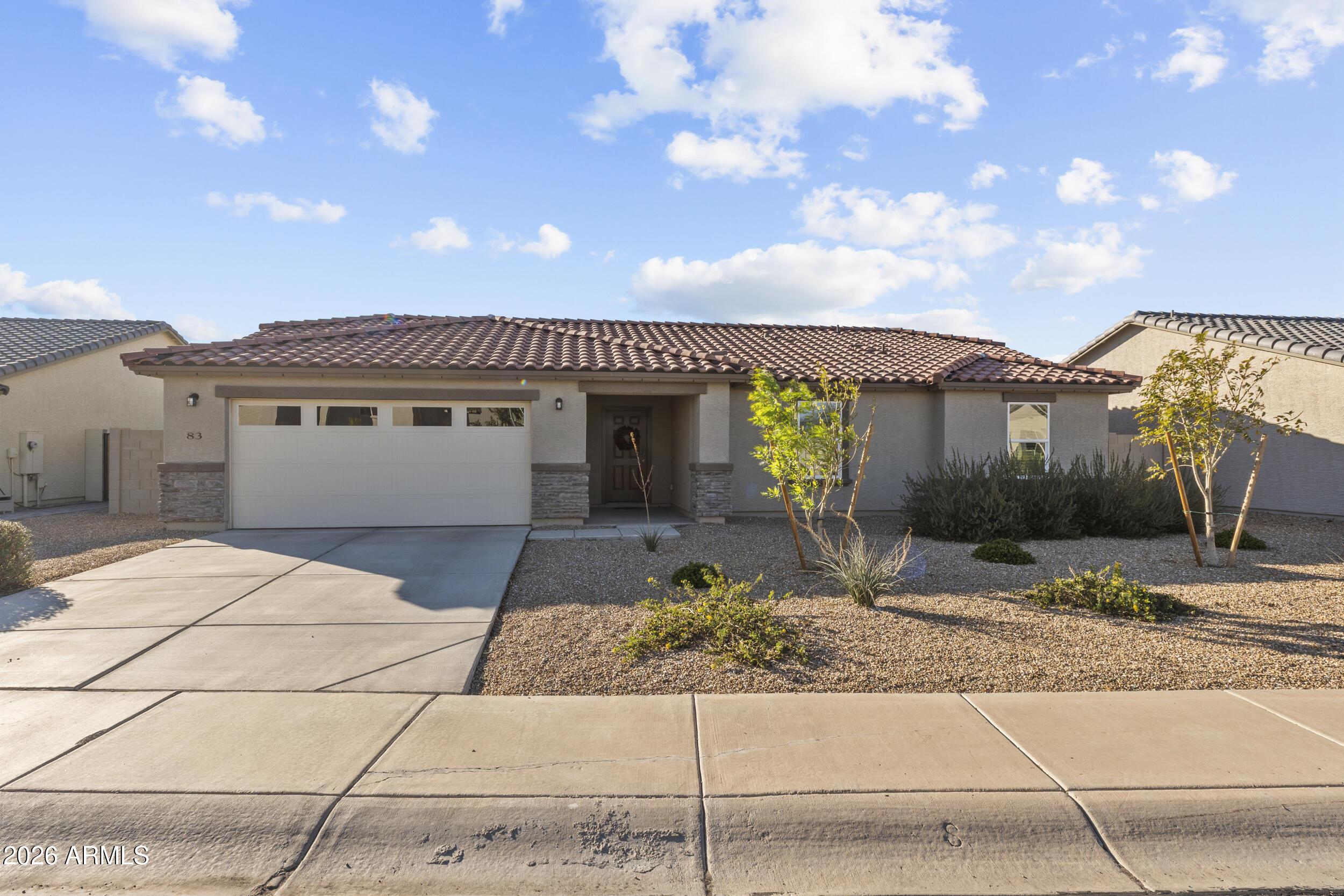 83 South Naples Lane Casa Grande, AZ 85122 - Photo 2 of 26 a front view of a house with garden