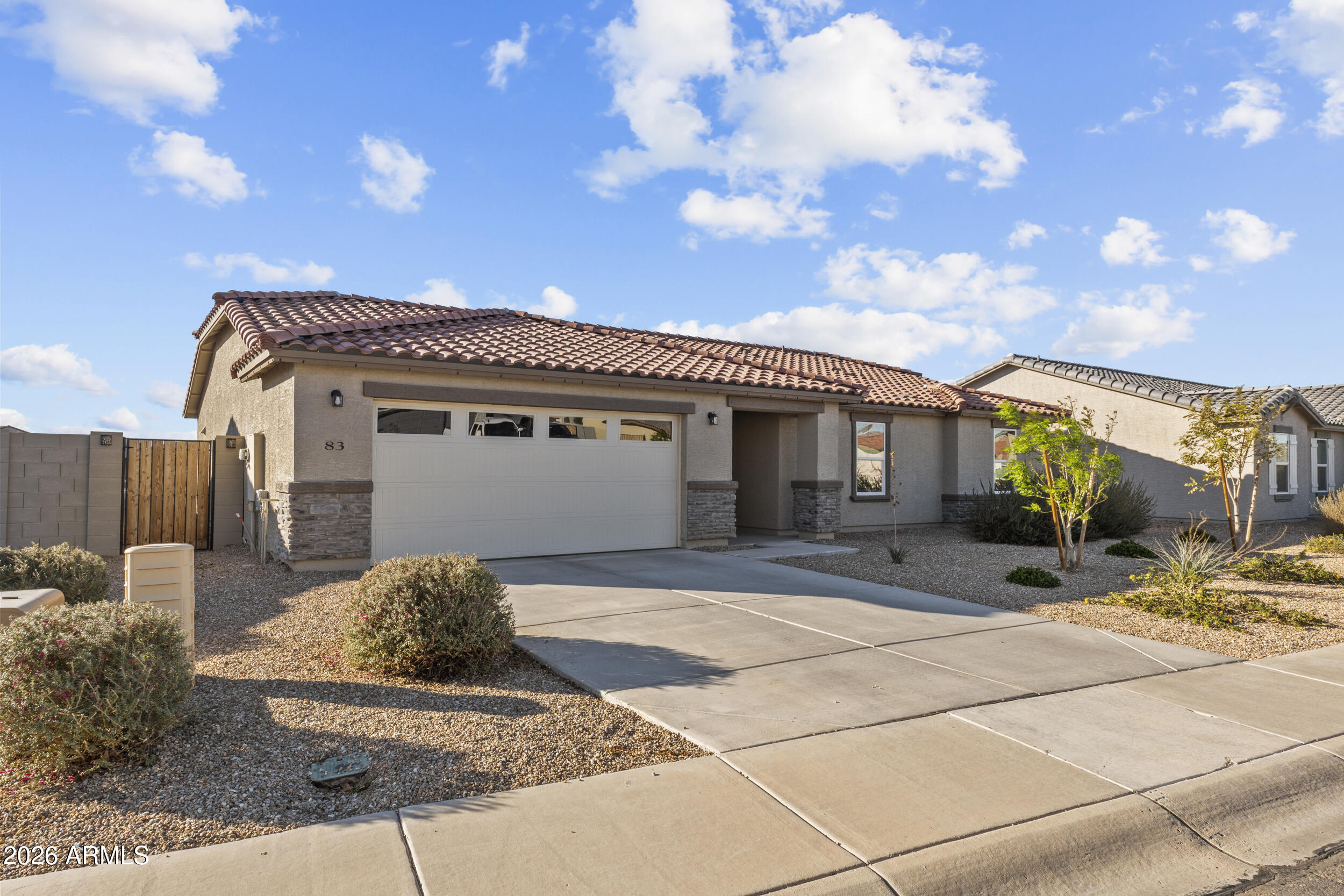 83 South Naples Lane Casa Grande, AZ 85122 - Photo 6 of 26 a front view of a house with yard