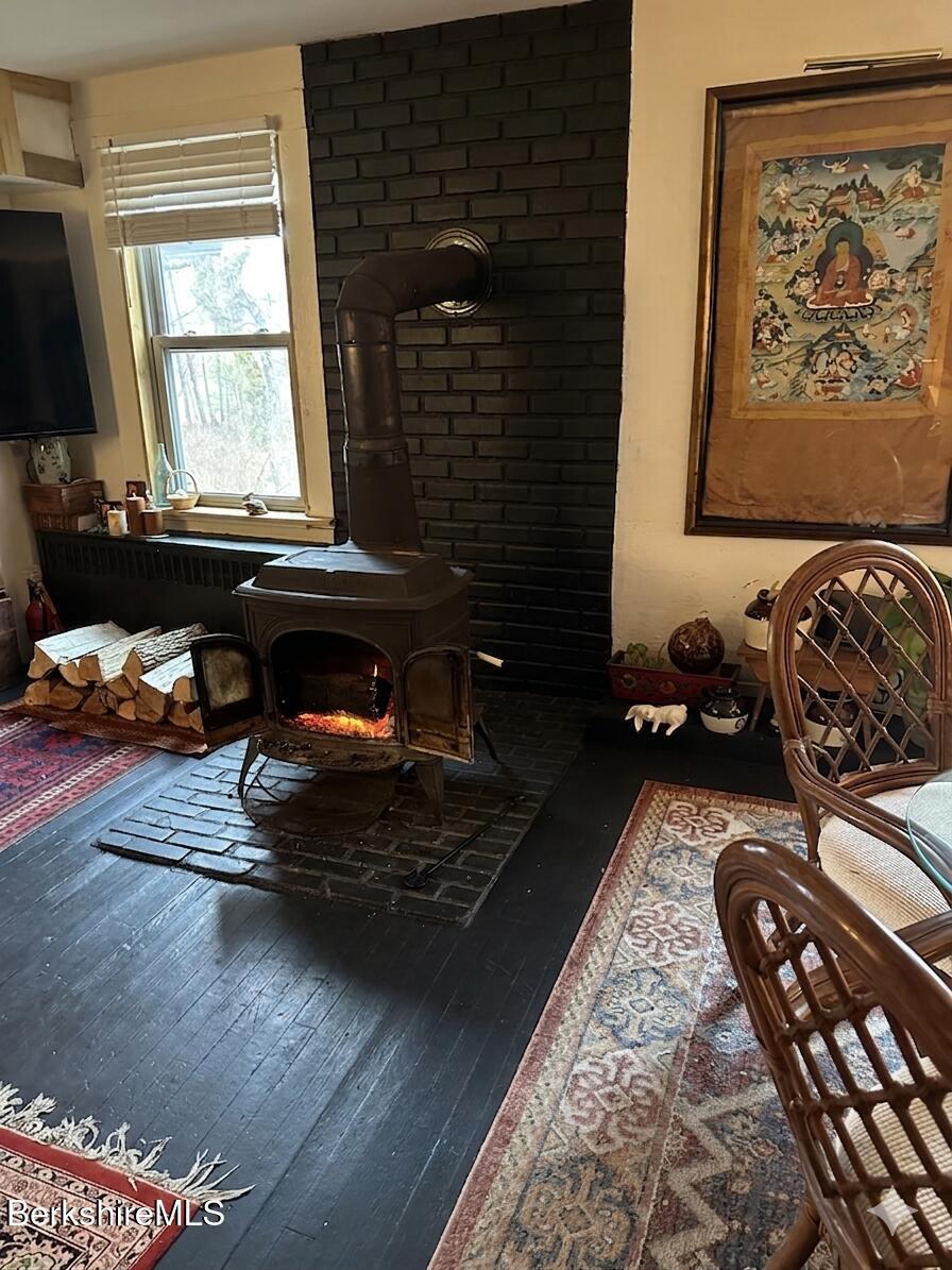 27 North Main Road Otis, MA 01253 - Photo 2 of 24 a living room with furniture window and a fireplace