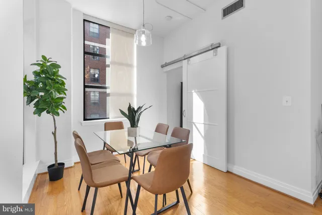 a view of a dining room with furniture and window