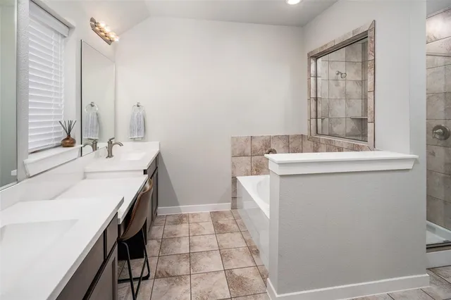 a bathroom with a sink a vanity and a mirror
