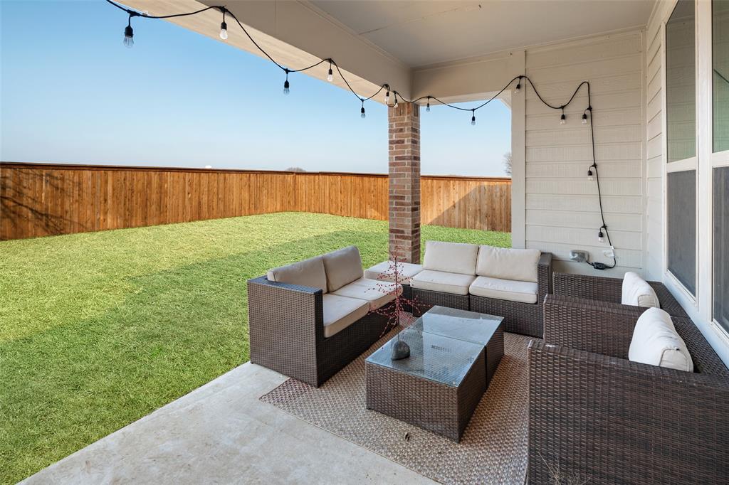 4209 Switchgrass Street Celina, TX 75009 - Photo 13 of 18 a backyard of a house with outdoor seating