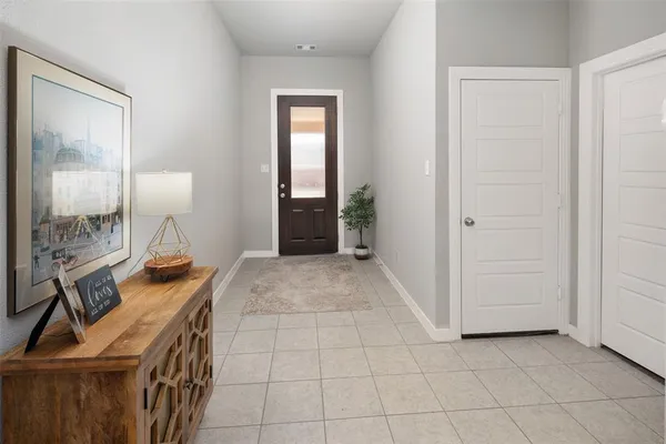 a view of a livingroom with furniture and front door