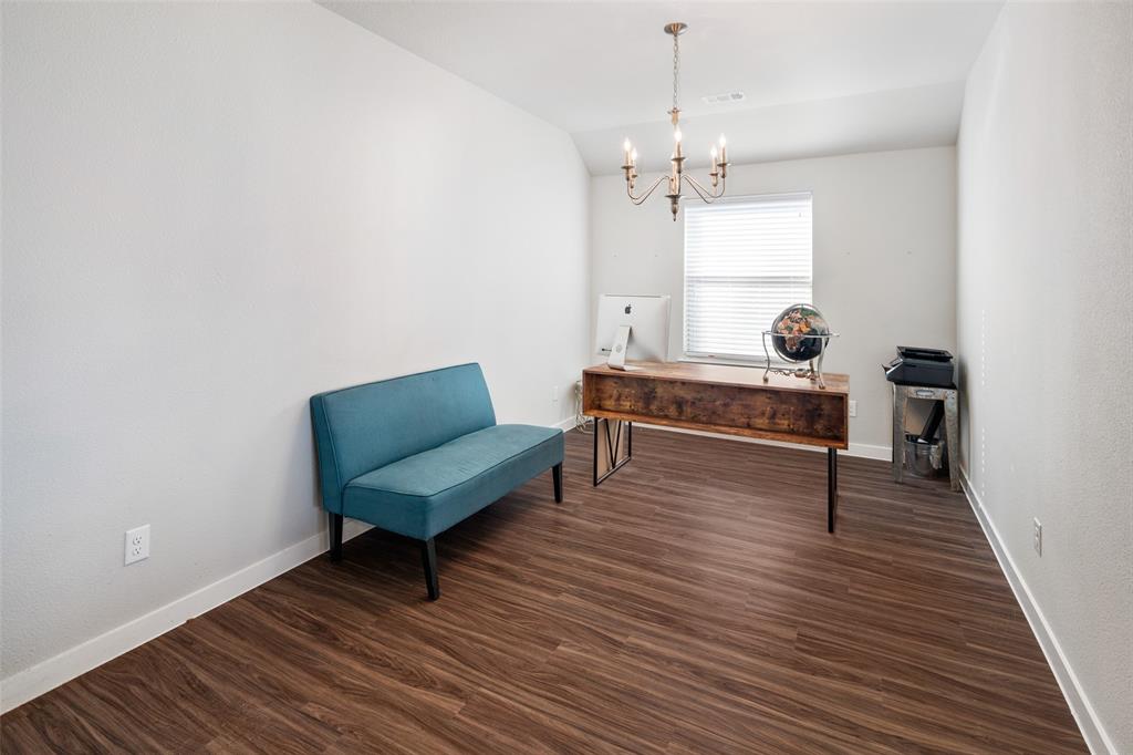4209 Switchgrass Street Celina, TX 75009 - Photo 4 of 18 a living room with furniture and a wooden floor