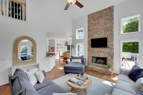 a living room with furniture and a fireplace