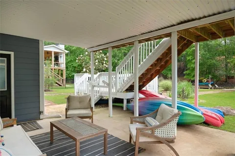 an aerial view of a house with garden space and street view