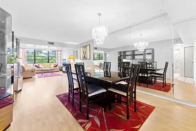 a living room with lots of furniture and a chandelier