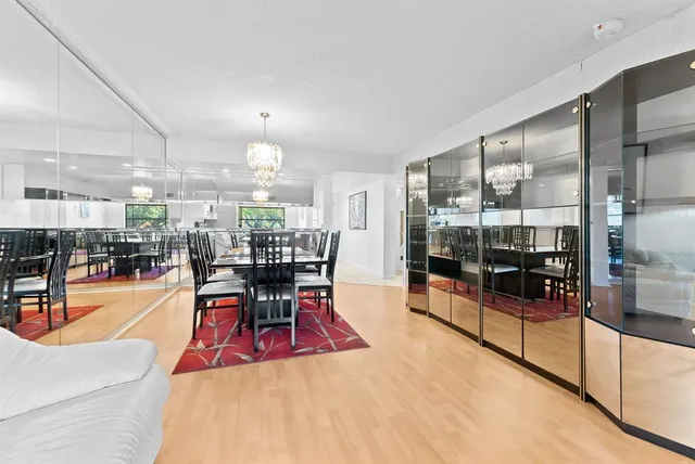 a dining room with furniture and a chandelier