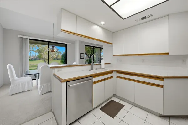 a kitchen with a sink and cabinets