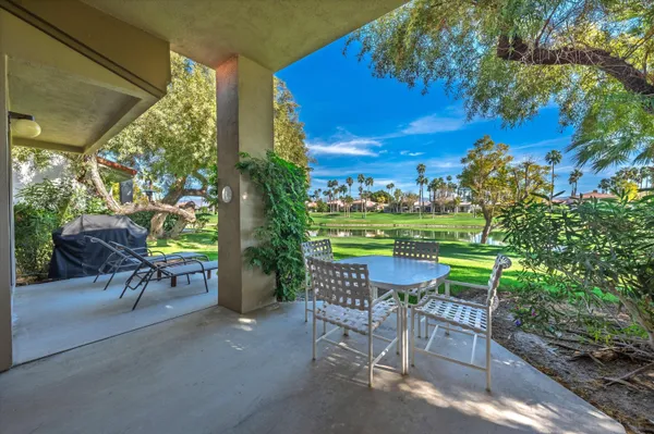 a view of a chairs and table in a yard