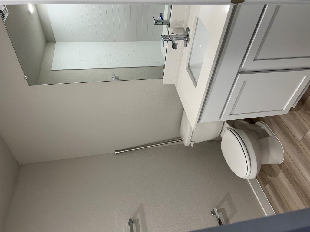 404 Coda Crossing Georgetown, TX 78633 - Photo 12 of 15 Full bath featuring light wood-style flooring and vanity